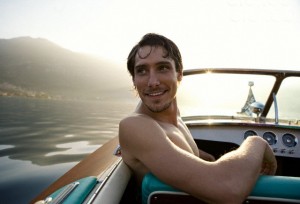 Young man boating on lake