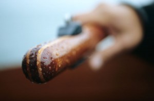 Close-up of hand holding wooden handle